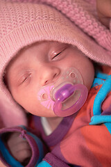 Image showing One month newborn baby sleeping in bed