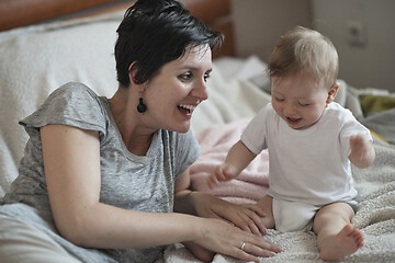 Image showing mother is playing with baby at home