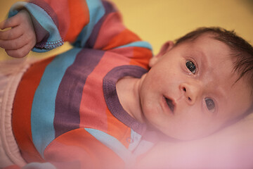 Image showing One month newborn baby sleeping in bed