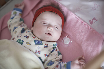 Image showing newborn baby sleeping at home in bed