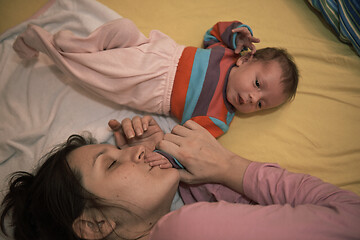 Image showing mother is playing with baby at home