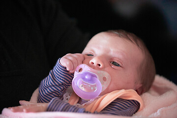 Image showing One month newborn baby sleeping in bed