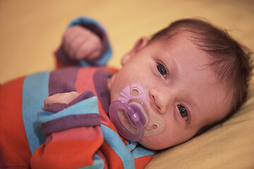 Image showing One month newborn baby sleeping in bed