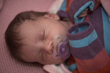 Image showing One month newborn baby sleeping in bed