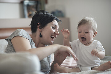 Image showing mother is playing with baby at home