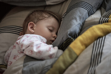 Image showing newborn baby sleeping at home in bed