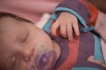 Image showing One month newborn baby sleeping in bed