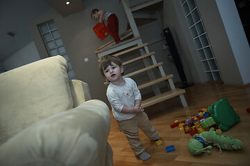 Image showing Adorable cute beautiful little baby girl playing with toys at home