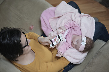 Image showing mother is playing with baby at home