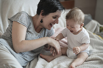 Image showing mother is playing with baby at home