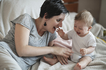 Image showing mother is playing with baby at home