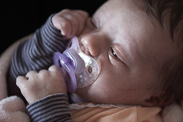 Image showing One month newborn baby sleeping in bed