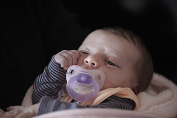 Image showing One month newborn baby sleeping in bed