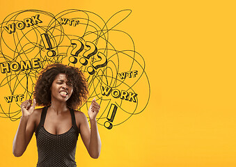 Image showing Young african-american woman with mixed thoughts