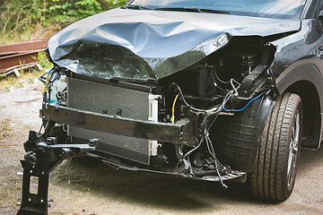 Image showing Broken and crashed modern car after an accident on street