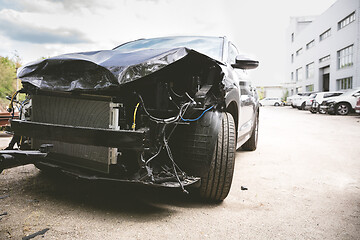 Image showing Broken and crashed modern car after an accident on street