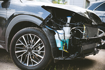 Image showing Broken and crashed modern car after an accident on street