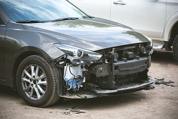 Image showing Broken and crashed modern car after an accident on street