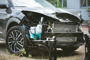 Image showing Broken and crashed modern car after an accident on street