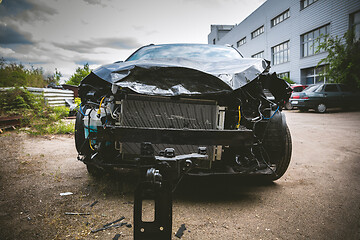 Image showing Broken and crashed modern car after an accident on street