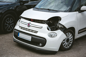 Image showing Broken and crashed modern car after an accident on street