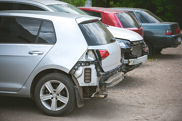 Image showing Broken and crashed modern cars after an accident on street