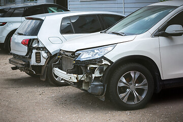 Image showing Broken and crashed modern cars after an accident on street