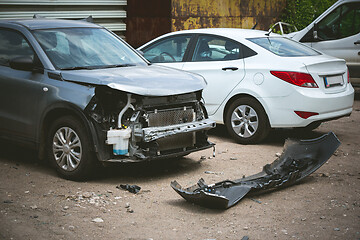 Image showing Broken and crashed modern cars after an accident on street