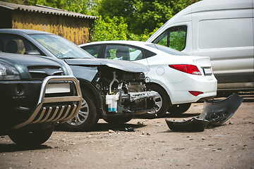 Image showing Broken and crashed modern cars after an accident on street