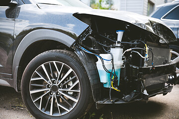 Image showing Broken and crashed modern car after an accident on street