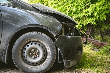 Image showing Broken and crashed modern car after an accident on street