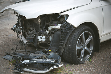 Image showing Broken and crashed modern car after an accident on street