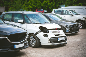 Image showing Broken and crashed modern cars after an accident on street