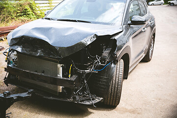 Image showing Broken and crashed modern car after an accident on street