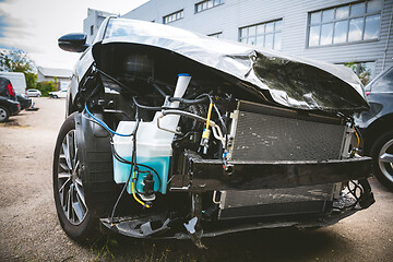 Image showing Broken and crashed modern car after an accident on street