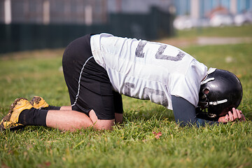 Image showing american football player resting after hard training