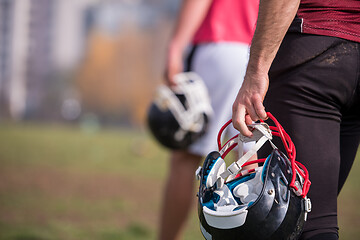 Image showing American football player holding helmet