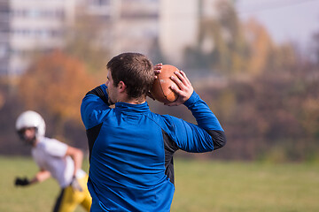 Image showing american football team with coach in action