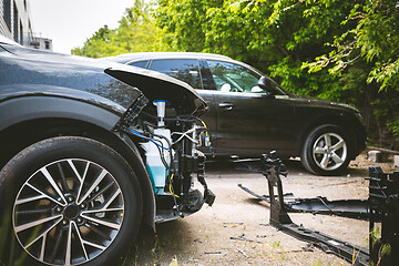 Image showing Broken and crashed modern car after an accident on street