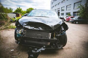 Image showing Broken and crashed modern car after an accident on street