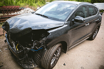 Image showing Broken and crashed modern car after an accident on street