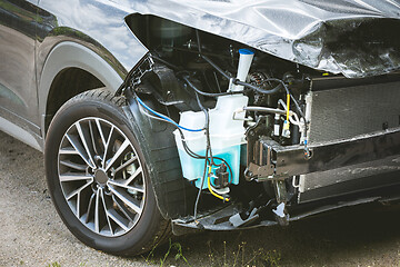 Image showing Broken and crashed modern car after an accident on street