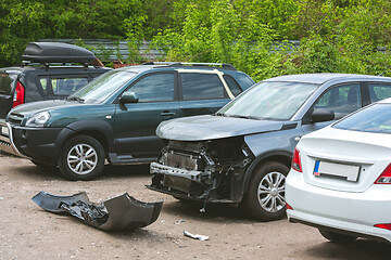 Image showing Broken and crashed modern cars after an accident on street