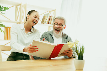 Image showing A daughter or granddaughter spends time with the grandfather