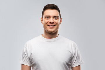 Image showing portrait of smiling young man in white t-shirt