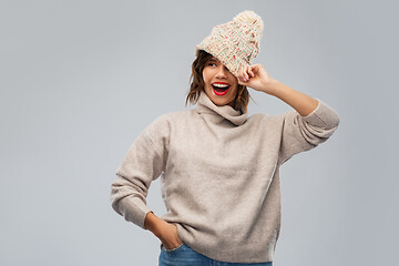 Image showing young woman in knitted winter hat and sweater