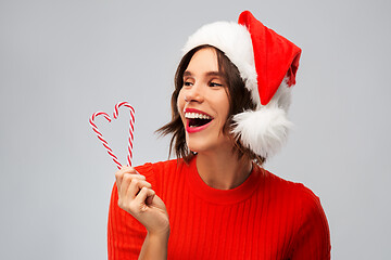 Image showing happy young woman in santa hat on christmas