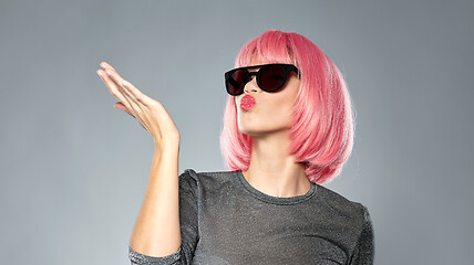 Image showing woman in pink wig and sunglasses sending air kiss