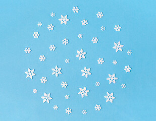 Image showing white snowflake decorations on blue background