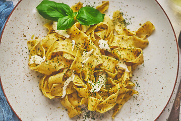 Image showing Tasty tagliatelle pasta with basil and green pesto